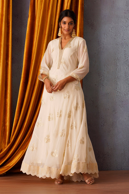 Off White sequin embroidered flared paneled kurta.