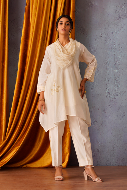 Sequin flower patch embroidered asymmetric tunic with cowl neck in off white
