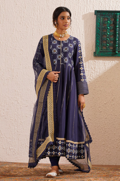 Block printed yoke and border anarkali with churidaar and organza dupatta.