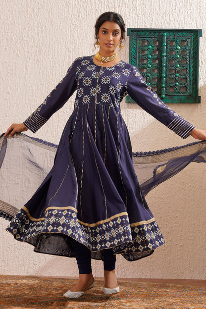 Block printed yoke and border anarkali with churidaar and organza dupatta.