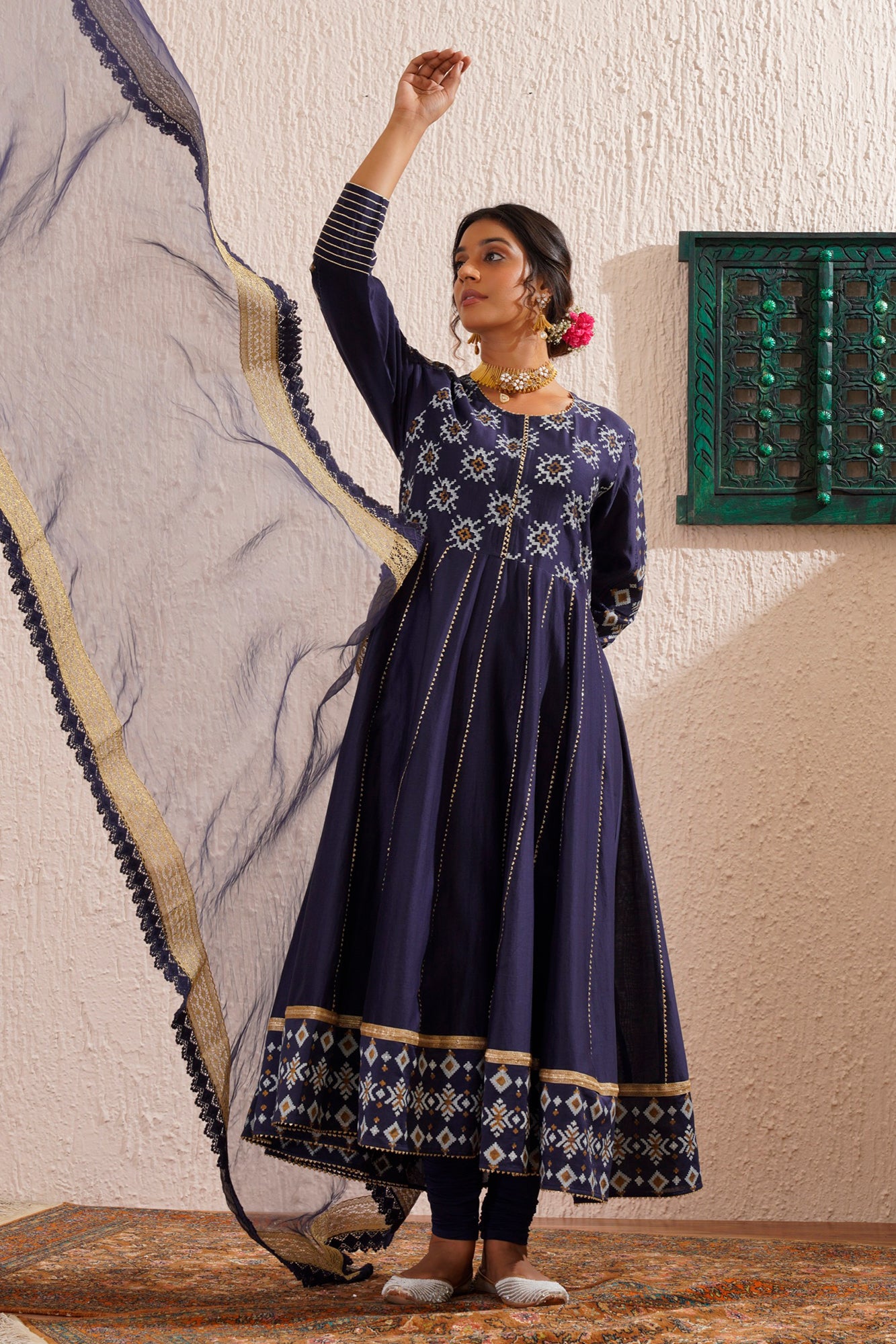 Block printed yoke and border anarkali with churidaar and organza dupatta.