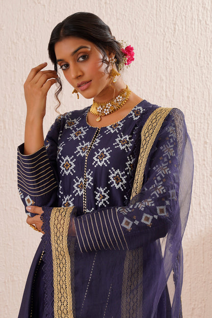 Block printed yoke and border anarkali with churidaar and organza dupatta.