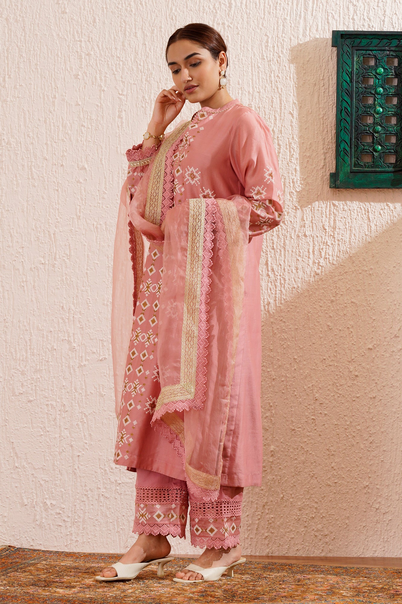 Block printed straight kurta set with lace detailing on pants and organza dupatta.