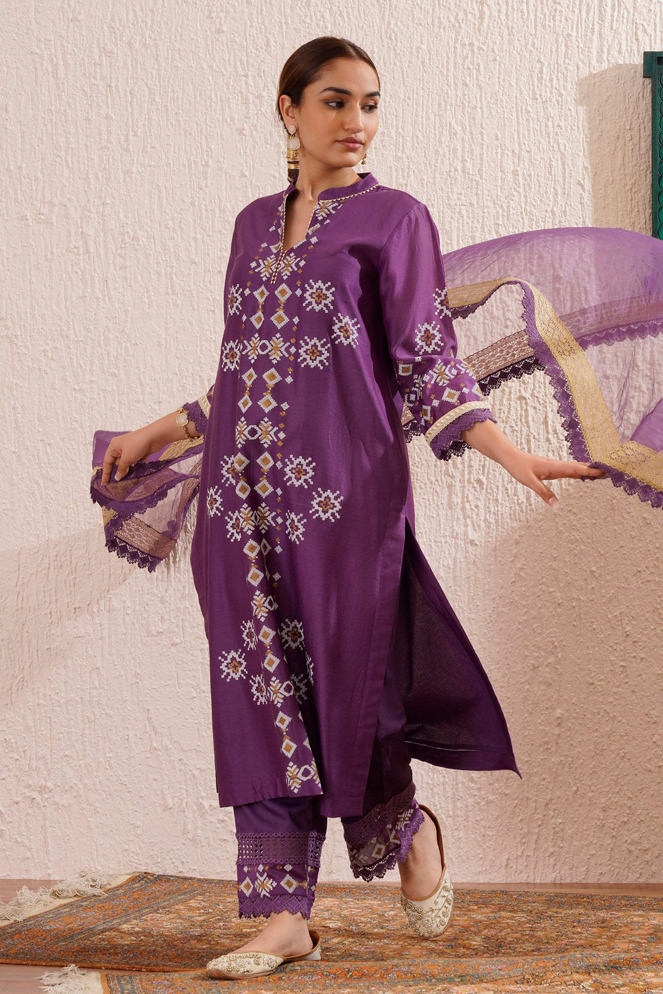 Block printed straight kurta set with lace detailing on pants and organza dupatta.