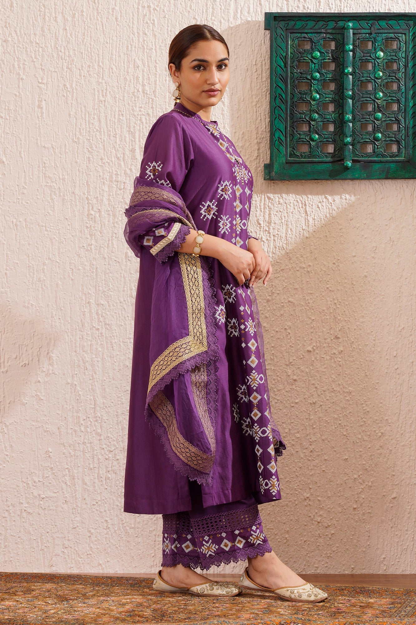 Block printed straight kurta set with lace detailing on pants and organza dupatta.