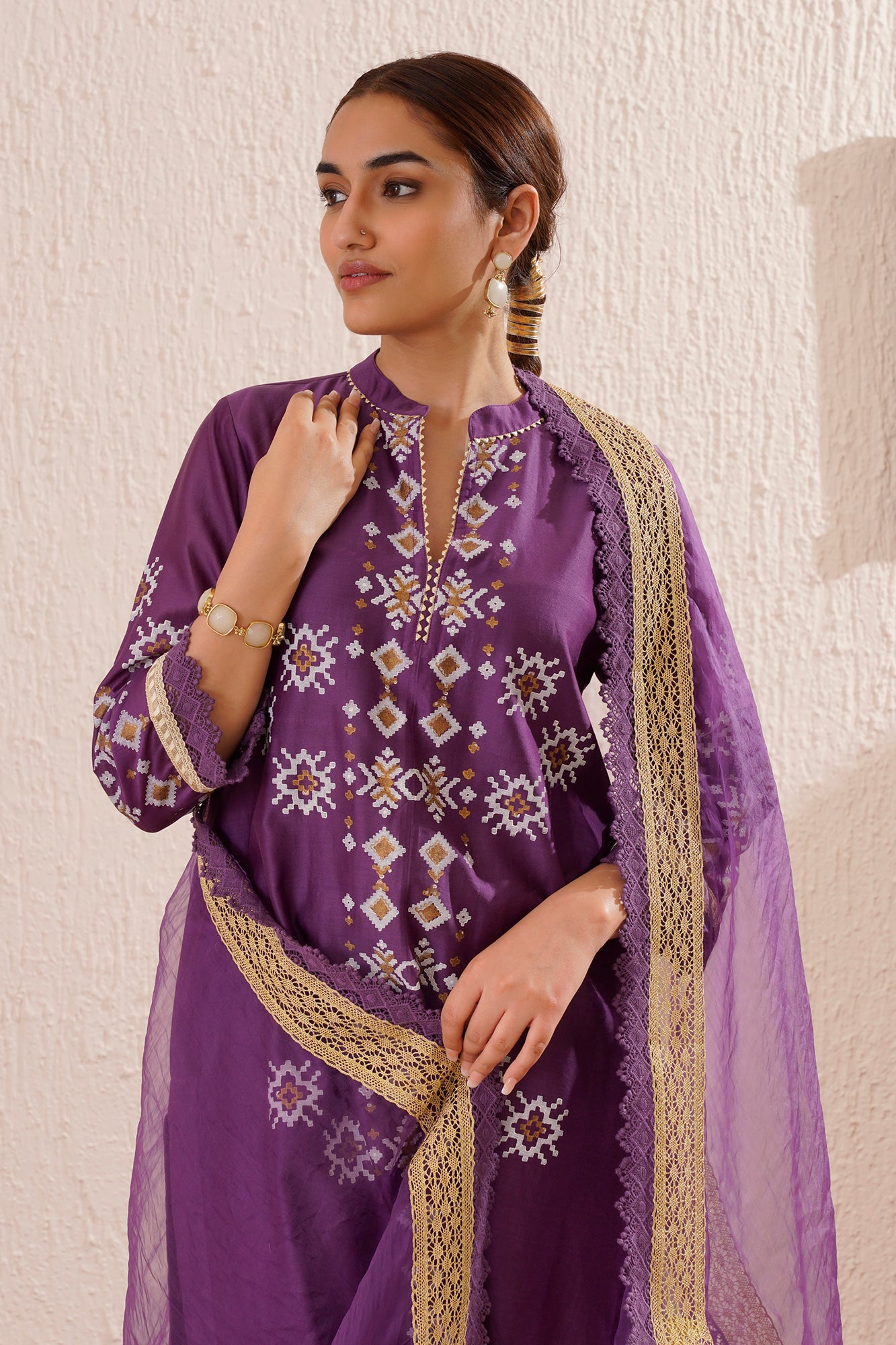 Block printed straight kurta set with lace detailing on pants and organza dupatta.