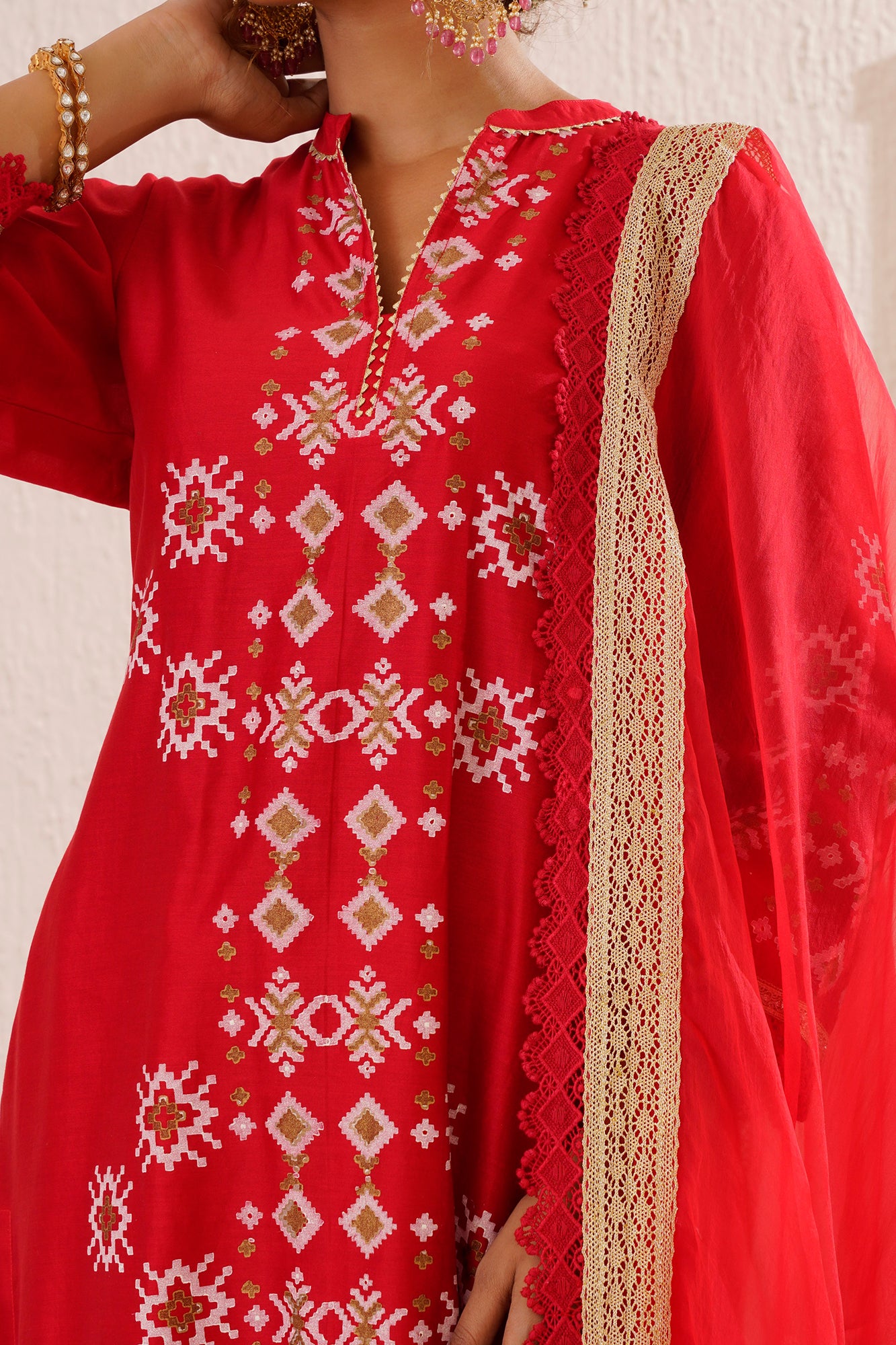 Block printed straight kurta set with lace detailing on pants and organza dupatta.