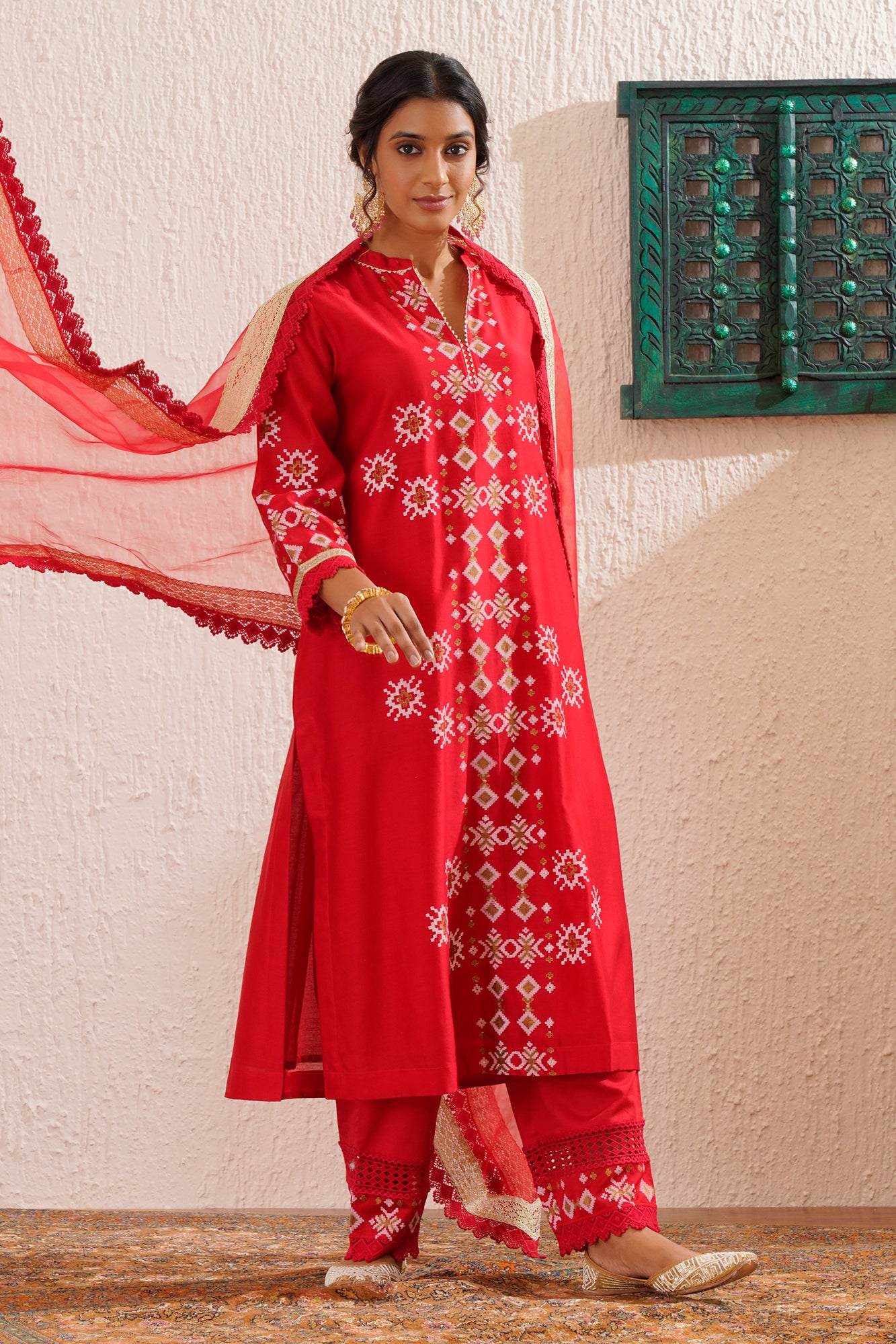 Block printed straight kurta set with lace detailing on pants and organza dupatta.