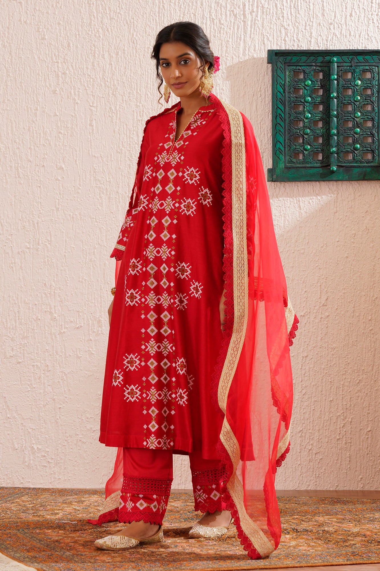 Block printed straight kurta set with lace detailing on pants and organza dupatta.