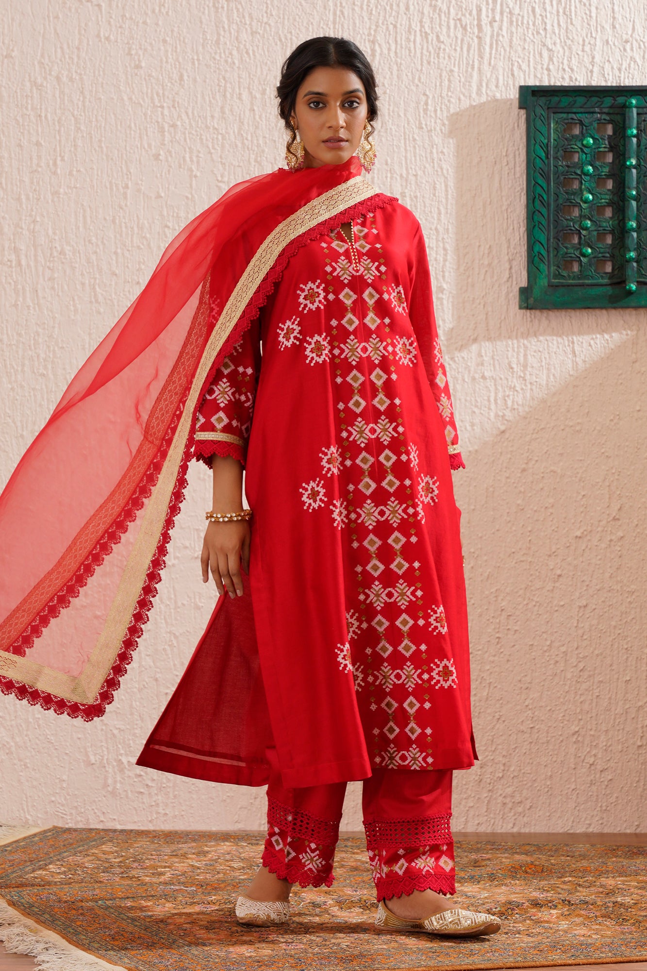 Block printed straight kurta set with lace detailing on pants and organza dupatta.