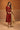 Rust velvet Jhumar kurta set with gold tissue dupatta, worn by a model