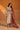 Light cream velvet Vira kurta set with red striped dupatta, worn by a model